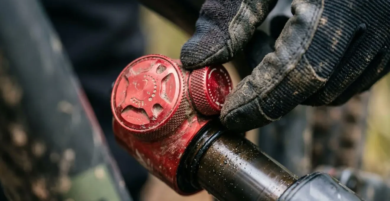 Extreme close-up of mountain bike rear shock rebound damping adjustment dial